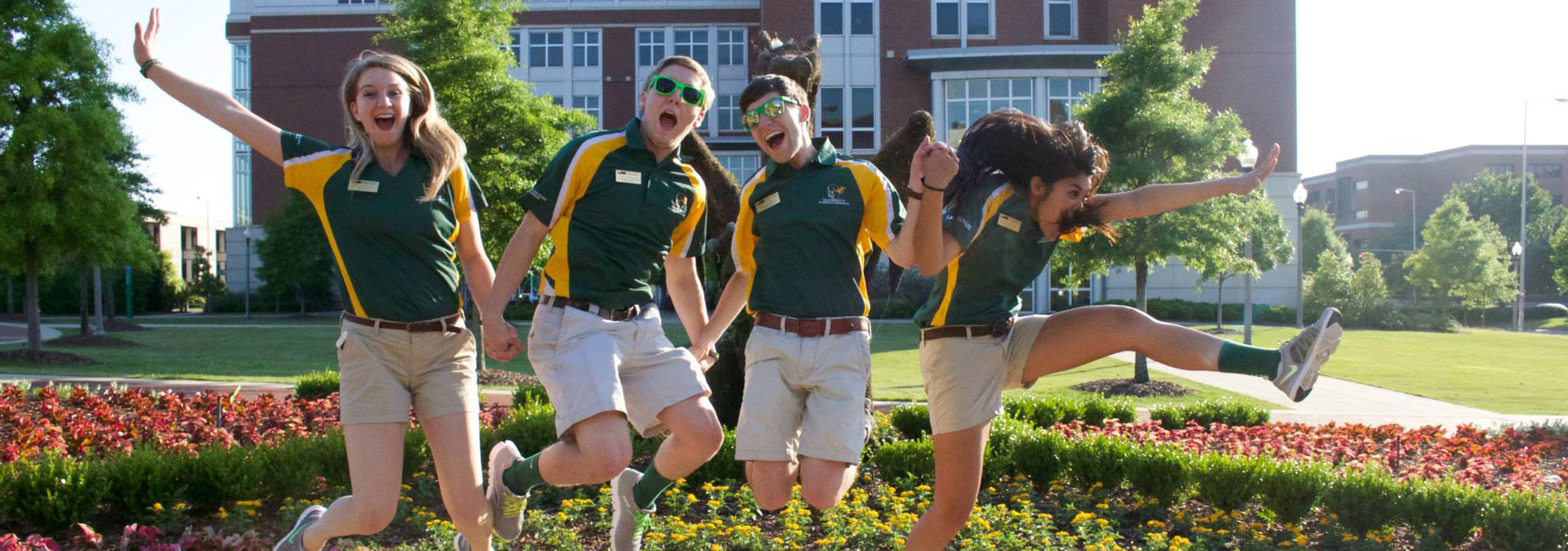 Students in front of a UAB sign.