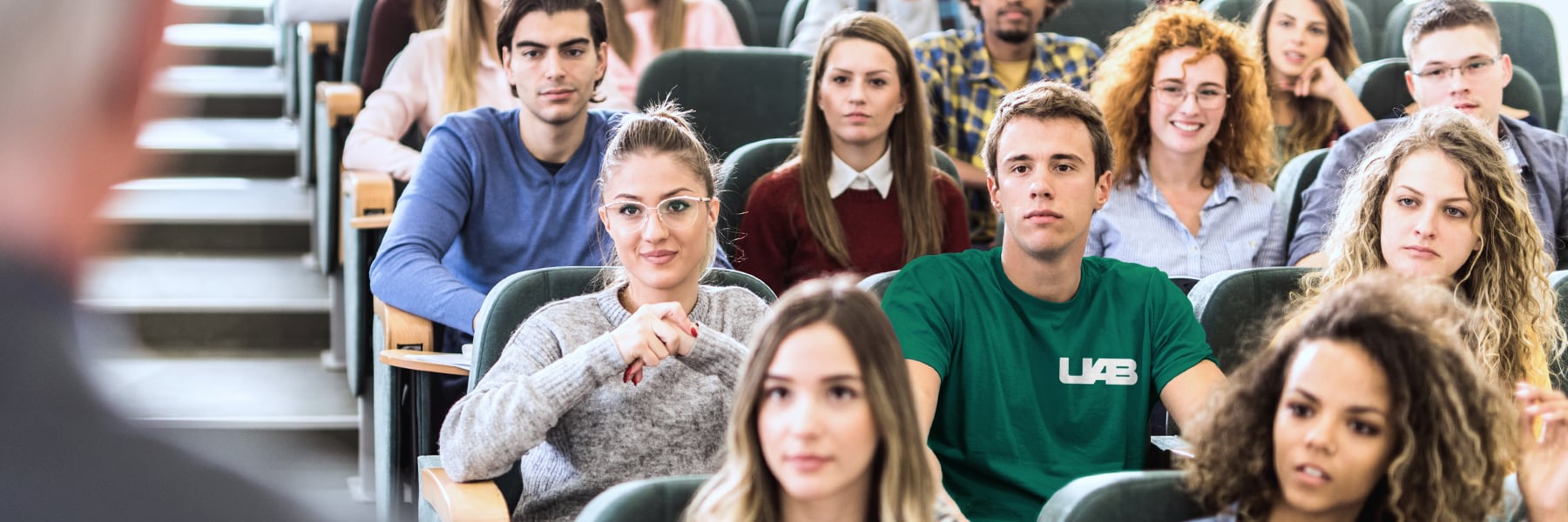 Students sitting in a classroom listening to a lecture.