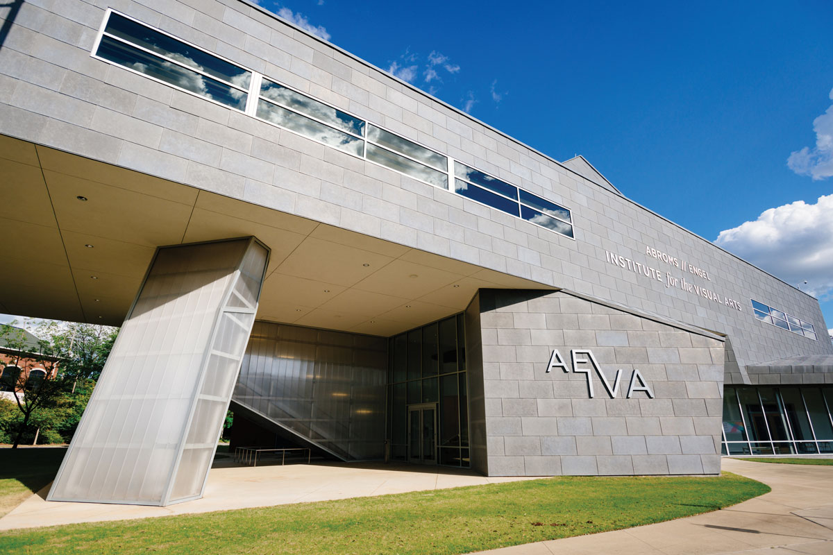 Front entrance of the Abroms-Engel Institute for the Visual Arts against a bright blue sky. 
