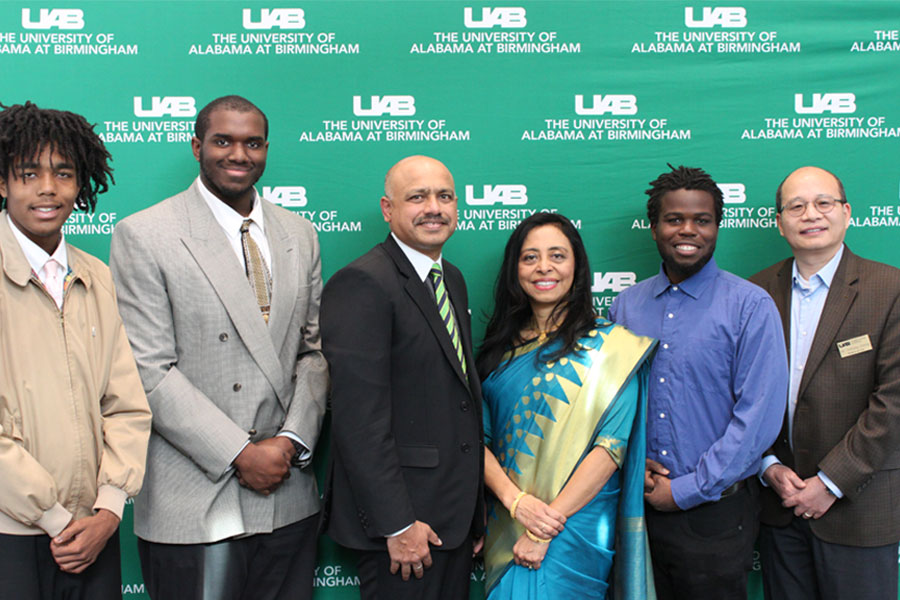 Dora and Sanjay Singh’s pose with scholarship recipients