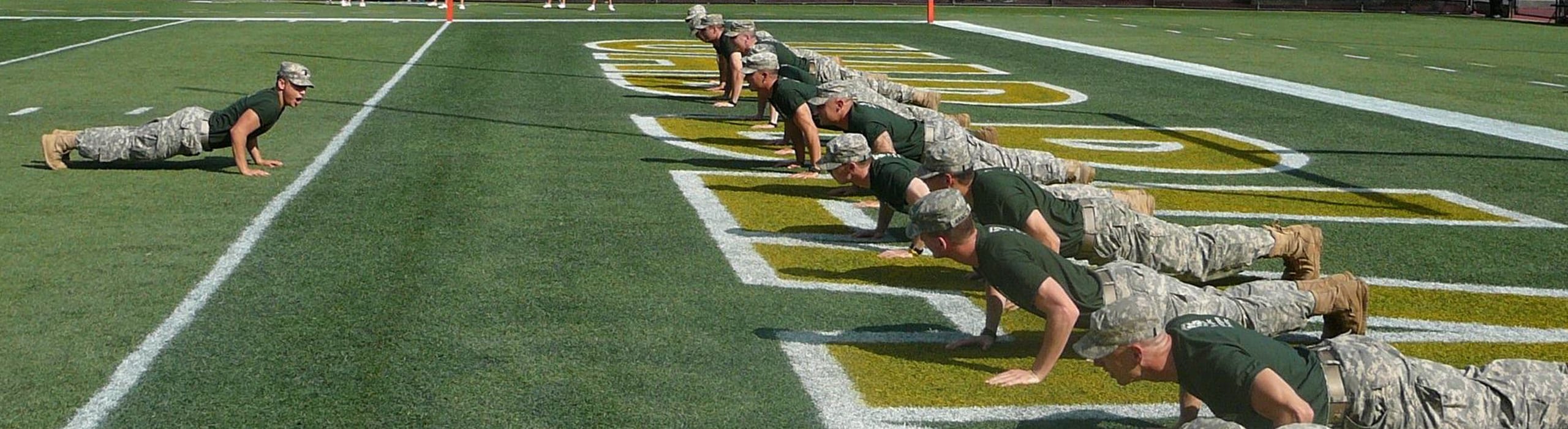 Army ROTC students studying and conversing.