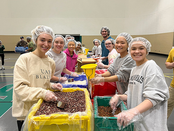 Collat students making meals during the 2022 Feed the Funnel event