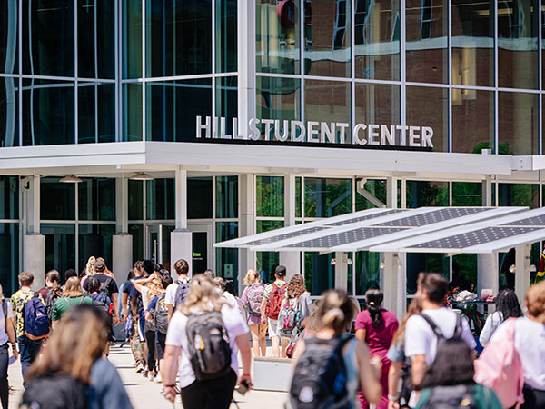 Students entering and exiting the UAB Hill Student Center. 