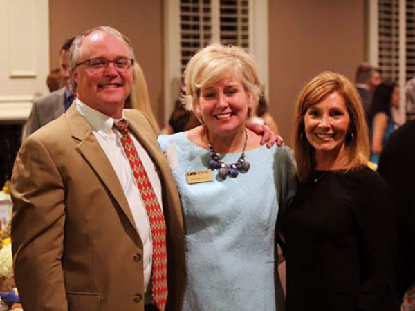 Kenny Wolfe with his wife Toni and Kristen Craig.