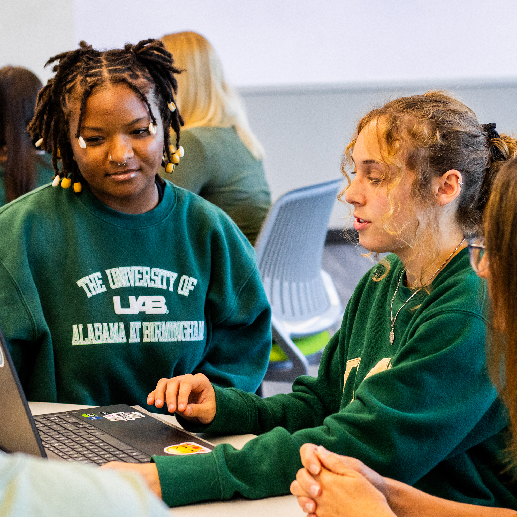 Two students sitting in the UHall computer science lab