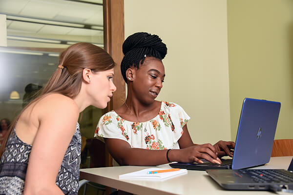 A tutor helping a student at the UAB Writing Center. 