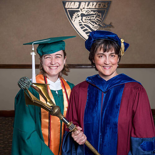 Graduate student Haley Cotton and Chair Alison Chapman at commencement. 