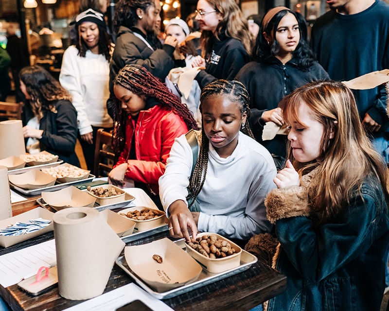 Students at a food fair. 