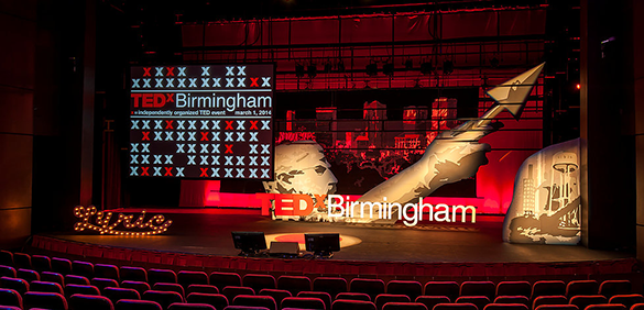 A view of the TEDxBirmingham stage with pictures of iconic Birmingham landmarks. 