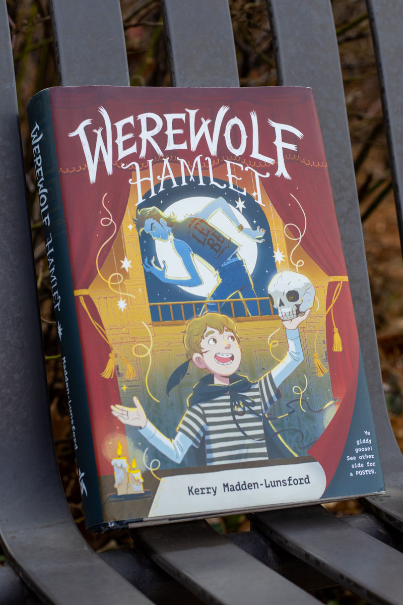 Cover of Werewolf Hamlet featuring a boy in a tied-on cape holding up a skull.