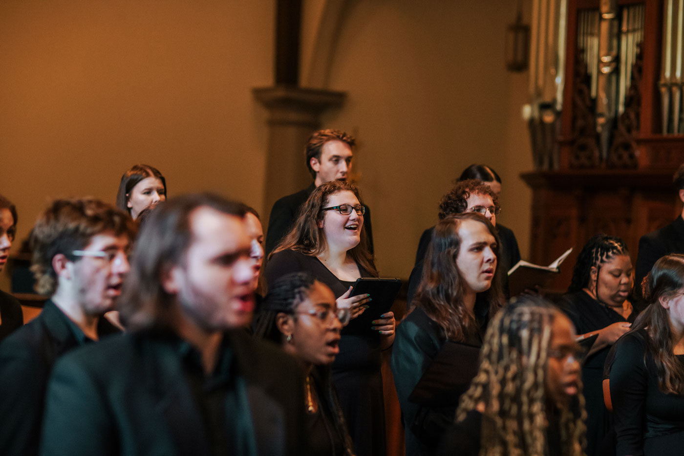 A closeup of some choir members during the concert.