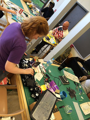 Students working with nontraditional materials in class. 