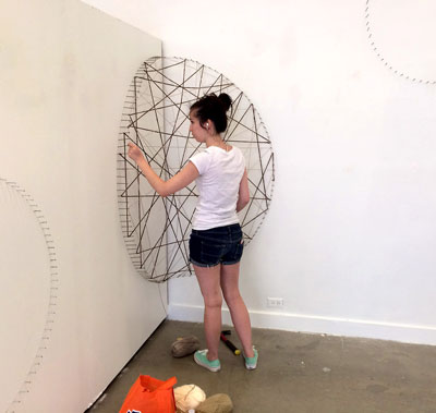 A student creating an art installation. 