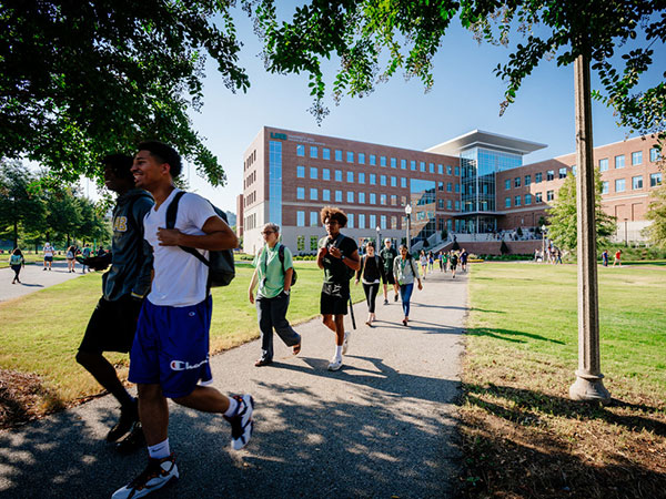 Students walking outside of University Hall. 