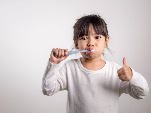 Adobe Stock image of little girl brushing her teeth