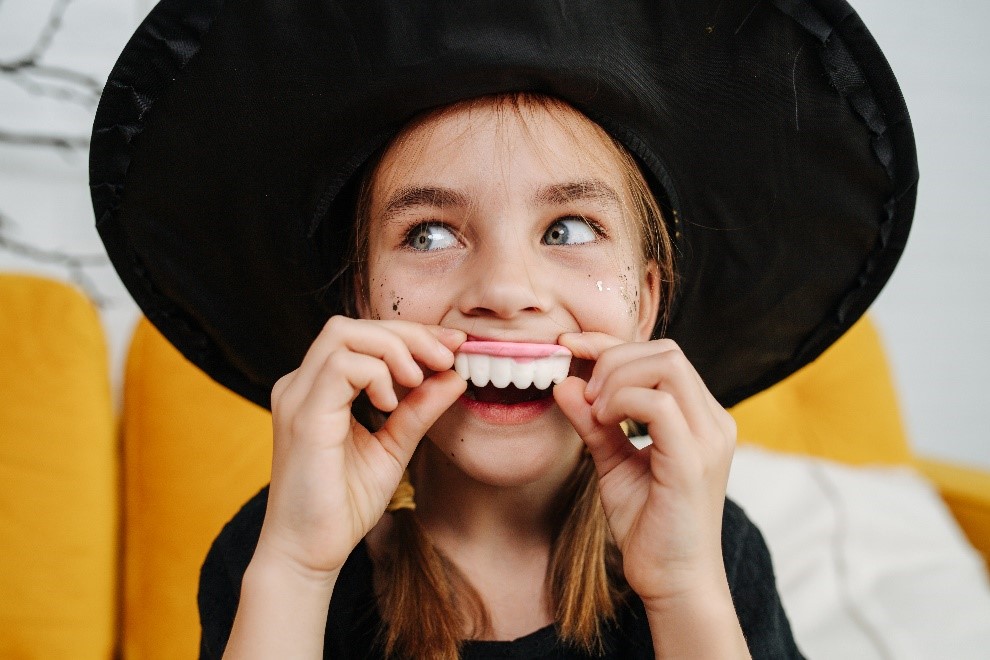 Adobestock photo of girl with prop teeth