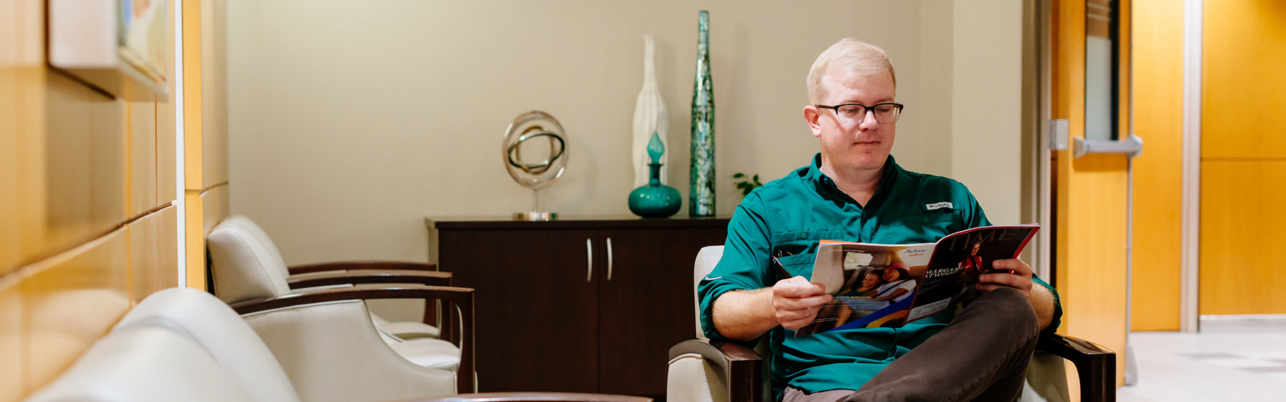 Man sitting in UAB Dental Group waiting area