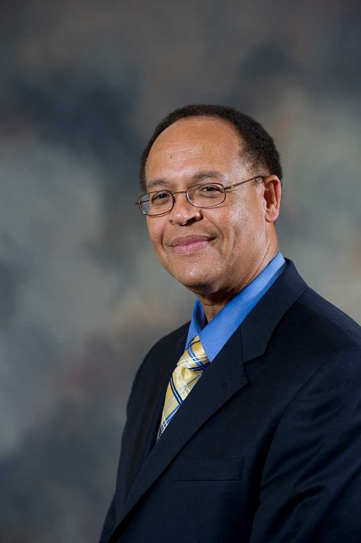 Jacob Martin sitting outside the School of Dentistry.
