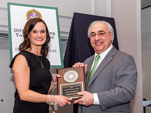 Dr. Hartsfield receives the award.