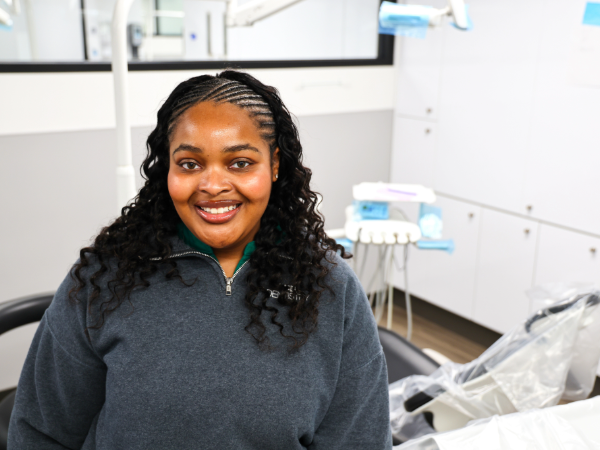 Smiling young woman in dental clinic