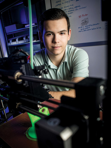 Forrest Satterfield, an attendee at the Clinton Global Initiative University summit, in a  BME lab.