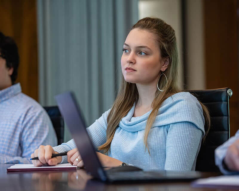 Female construction executive at a meeting. 