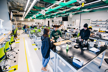 Overall of engineering students working in the Design x Prototyping Lab in Gorrie Hall.
