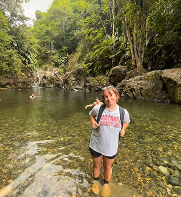 Chloe Naquin standing in stream