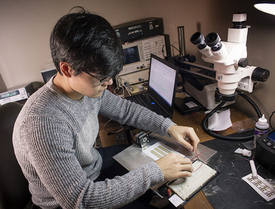 ECE student Skyelar Kim working in a laboratory. 