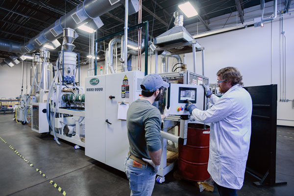 Two men  working at the MPAD facility. 