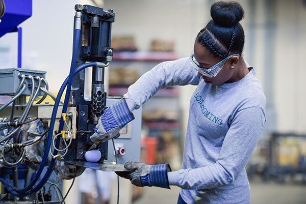 student working with machine in MPAD facility