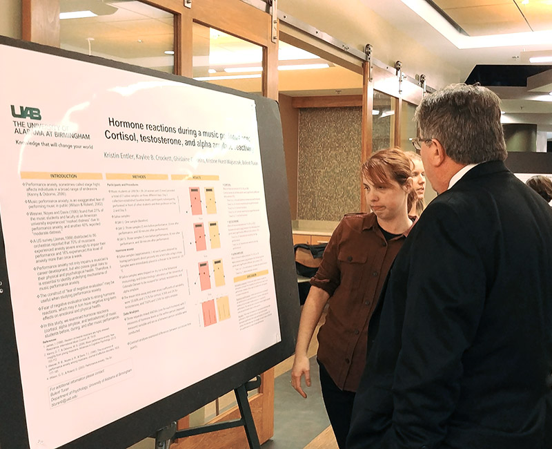 Photo of people reading a poster