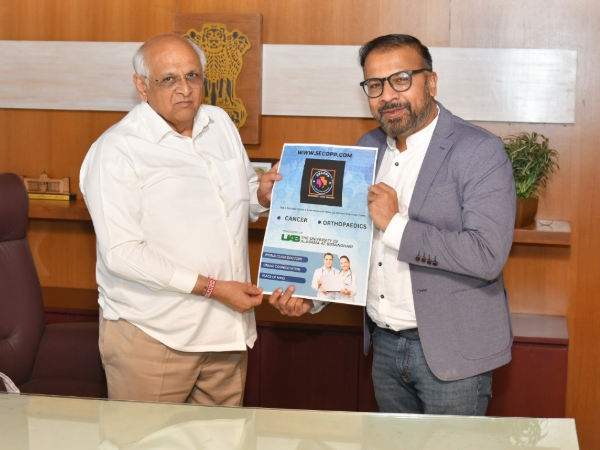 Ashish Shah (right) celebrating the launch of SecOpp with Chief Minister of Gujarat Bhupendra Patel.