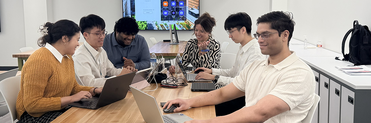 Group image of Heersink AI Founders Club working together at a table.