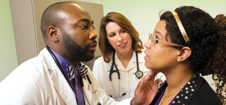 doctor examining patient