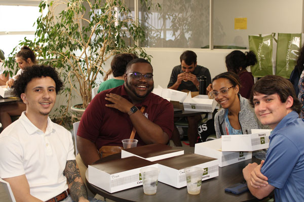 CU2RE students eating lunch together.