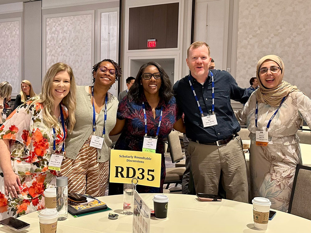 Kala Dixon, Ph.D., Adrienne Fowler-Payne, MPA, Shyla K. Fields, MBA, Earl Salser Jr., M.D. and Sumayah Abed, M.D. pause for a photo.