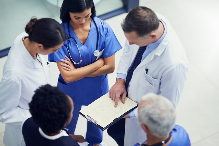 Image of medical providers standing in circle