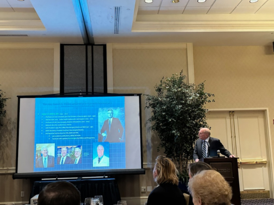 Dr. Mark Hadley presenting at a gala at UNC