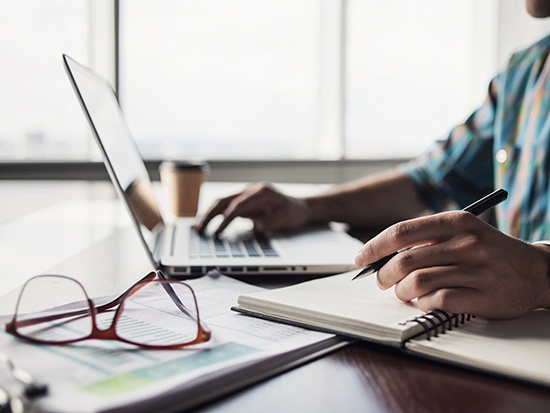 photo of guy sitting at desk in office