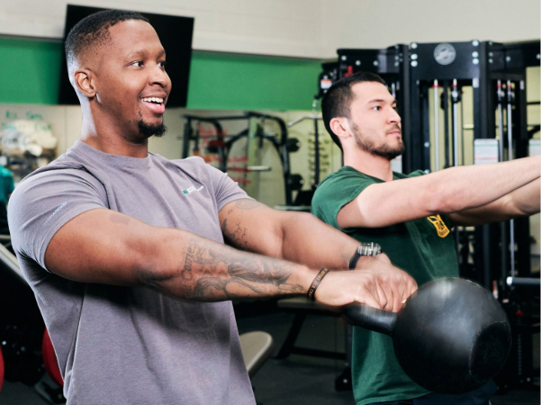 Two men exercising in a gym