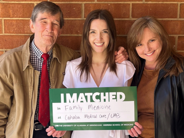Medical student poses with an I Matched Family Medicine sign