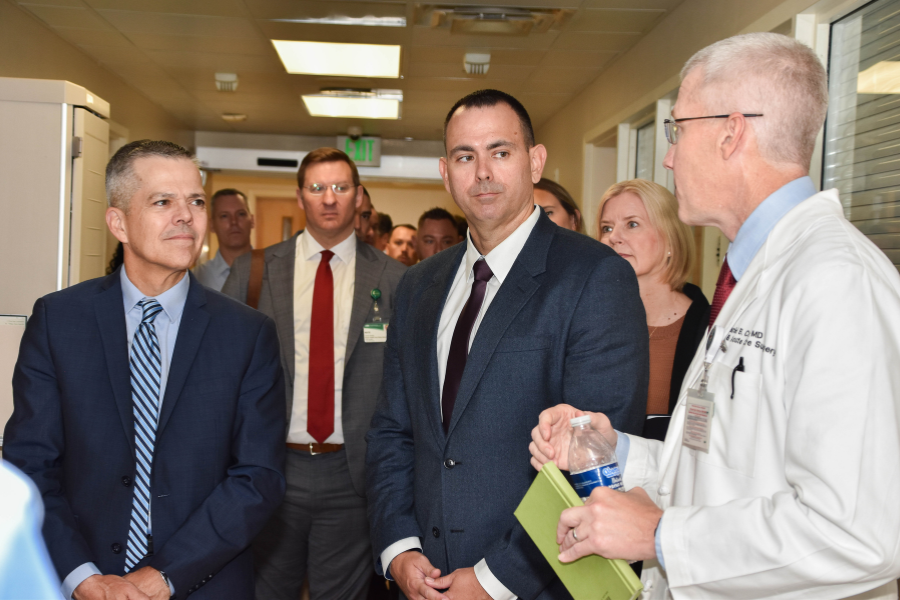 U.S. Air Force Lt. Gen. John J. DeGoes, left, Air Force Medical Command commander, and Chief Master Sgt. James M. Woods, middle, AFMEDCOM senior enlisted leader, tour UAB Hospital with UAB Trauma Medical Director Dr. Daniel Cox, right.