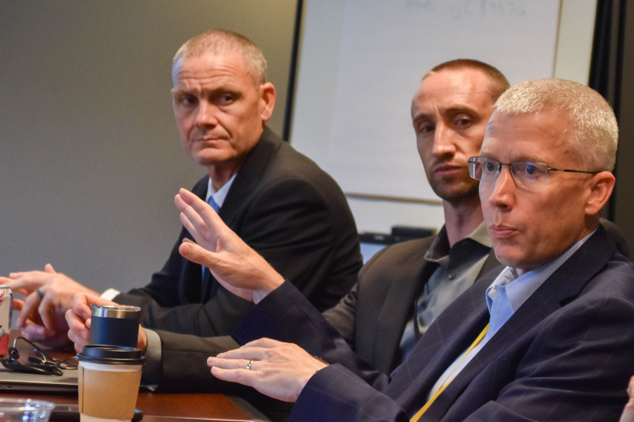 Dr. Daniel Cox, right, makes final remarks.