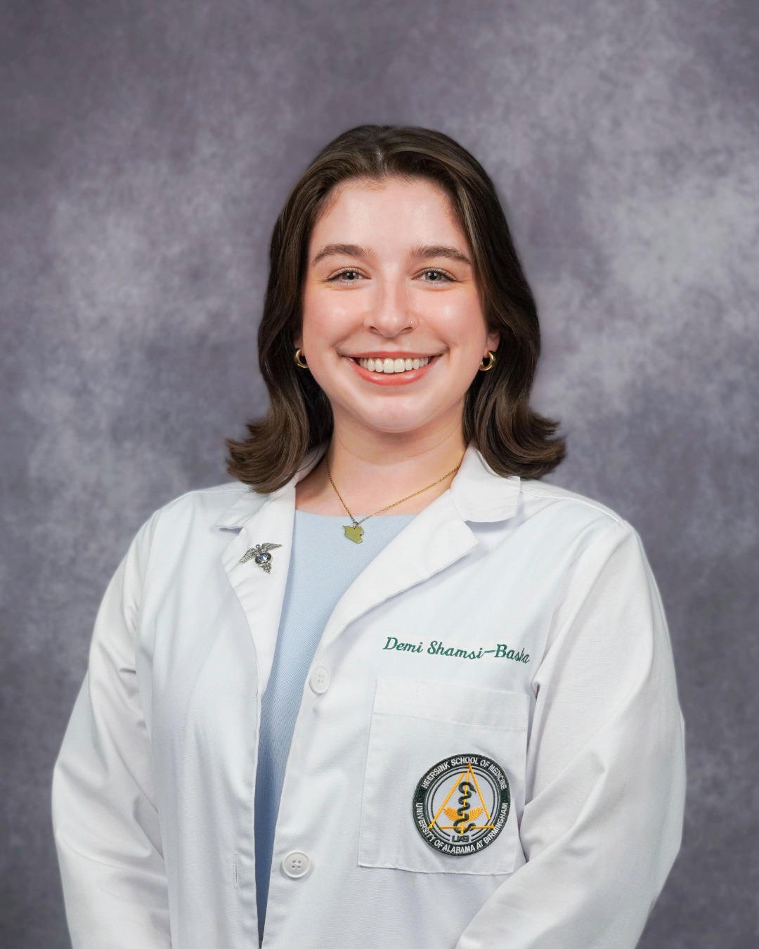 demi headshot white coat