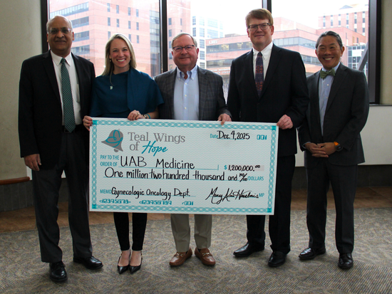 Teal Wings of Hope and Heersink School of Medicine administration as $1.2 million check presentation