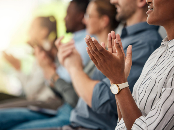 Stock image of hands clapping in celebration