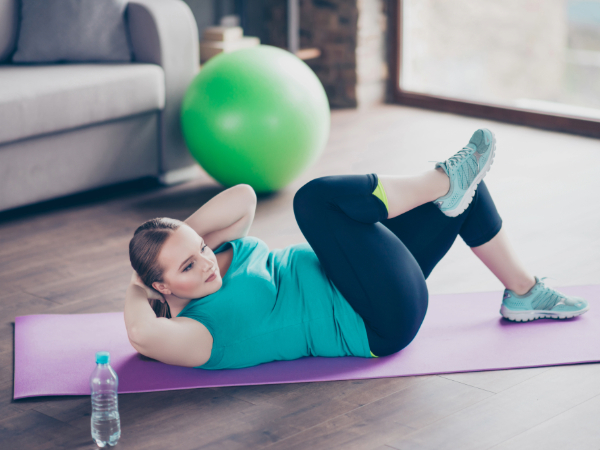 Woman exercises at home