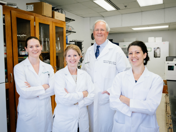 Dr. Karen Jaunarajs, PhD (Instructor, Neurology), Dr. David Standaert, MD (Professor/Chairman, Neurology), and Dr. Mariangela Scarduzio, PhD (Assistant Professor Neurology) group photo in Center for Neurodegeneration and Experimental Therapeutics research laboratory