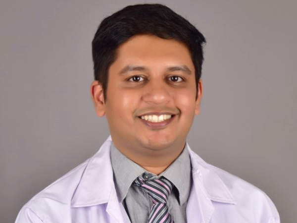 Dhawan headshot with white coat